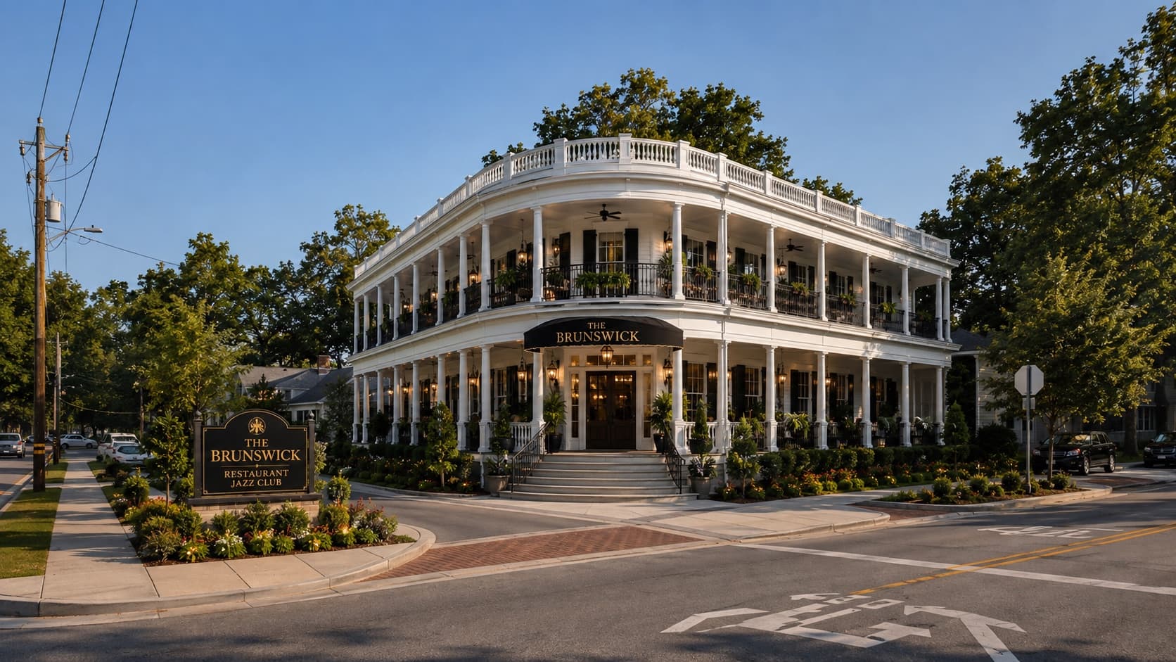 The rebuilt Brunswick on Depot Street, a two-storey white building with wide columned porches on both levels
