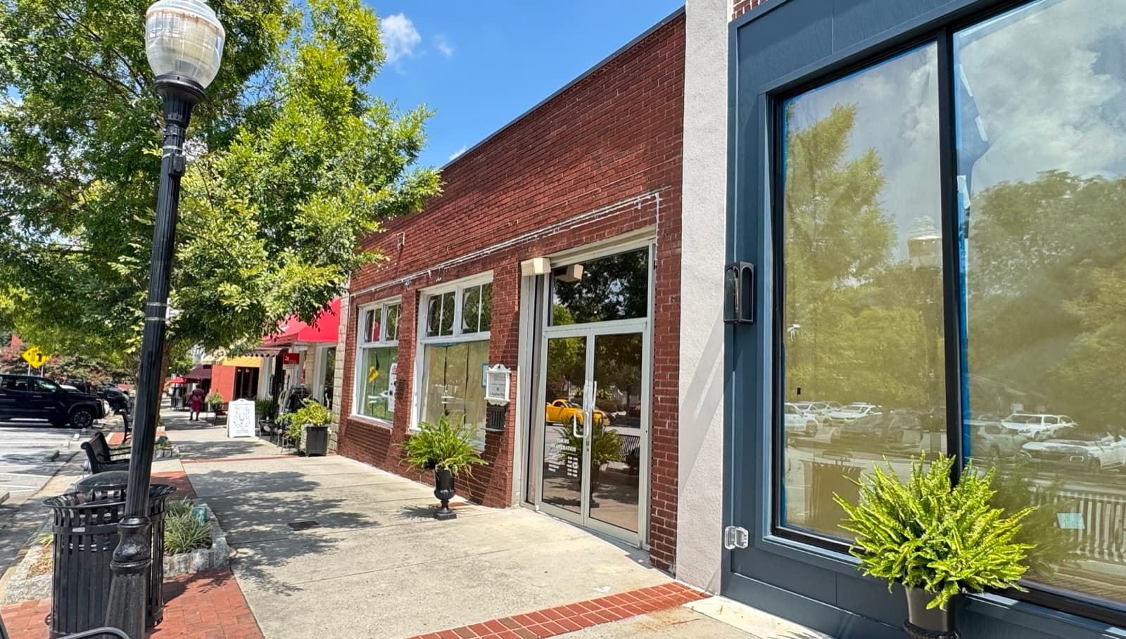 58 College Street before conversion — a plain brick storefront with papered windows