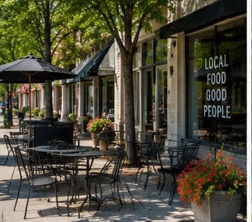 Café tables and planters in the Foundry Row pocket park